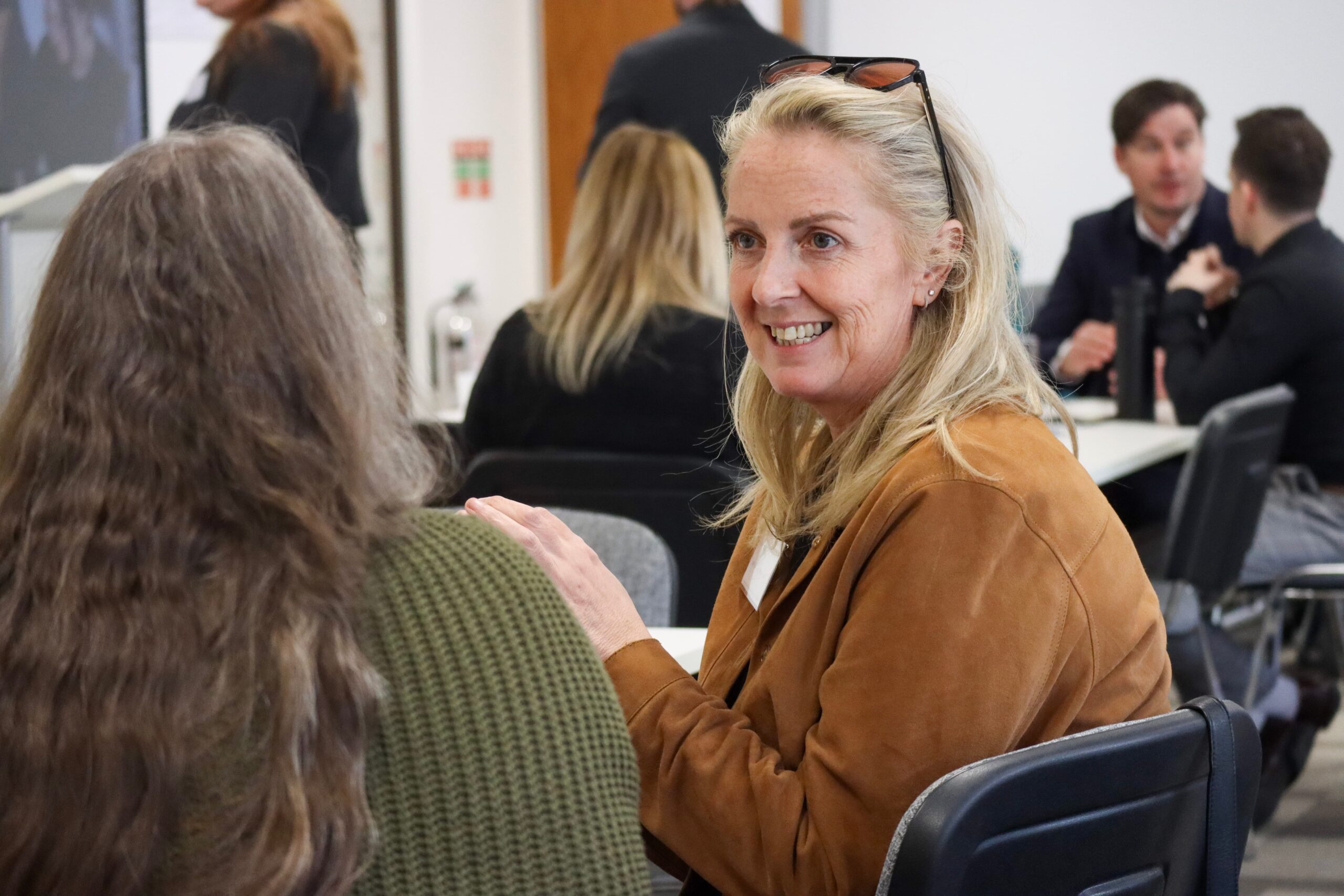 A picture showing people in pairs having discussion