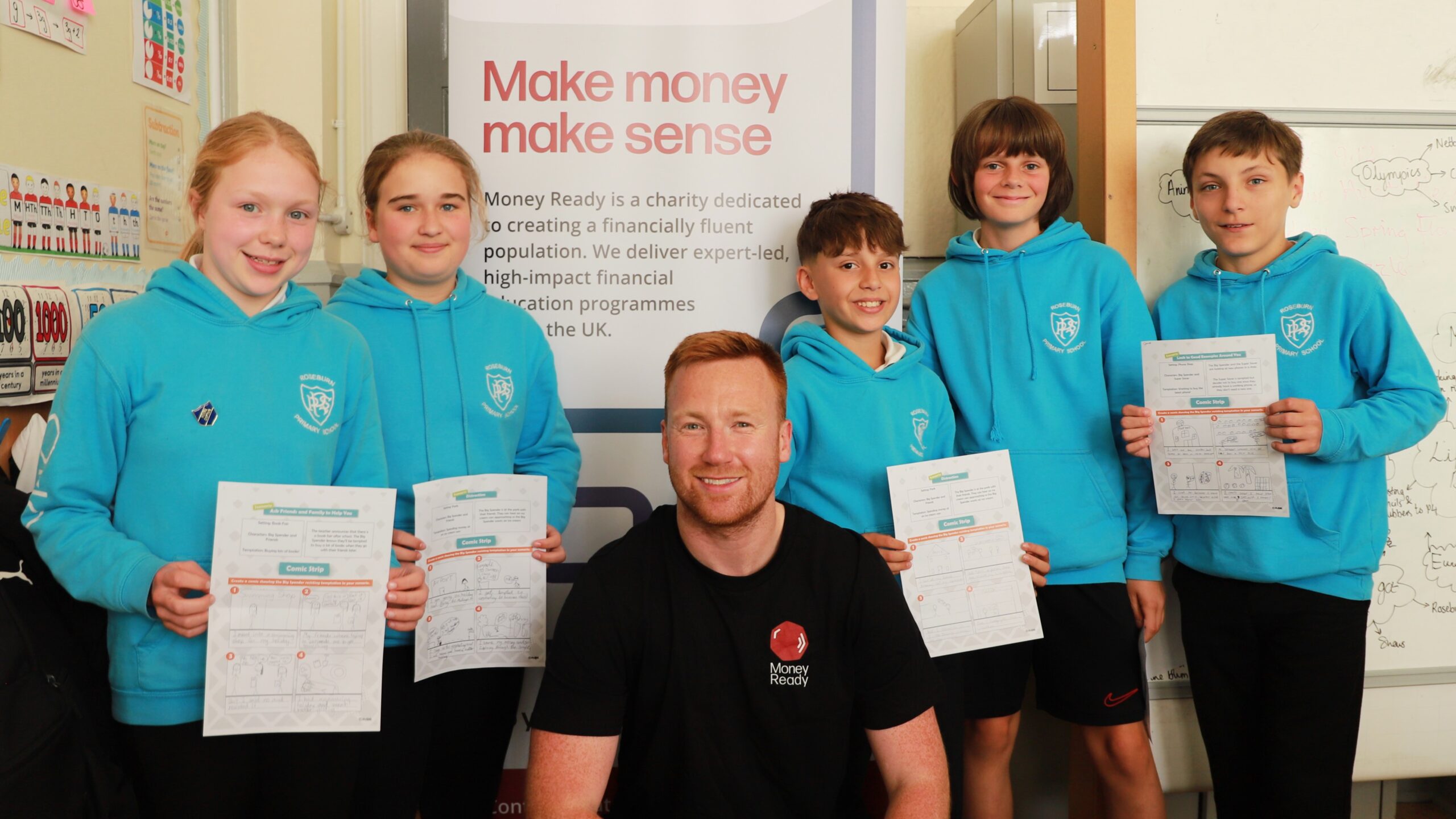 A group photo of a Money Ready trainer with the students he trained