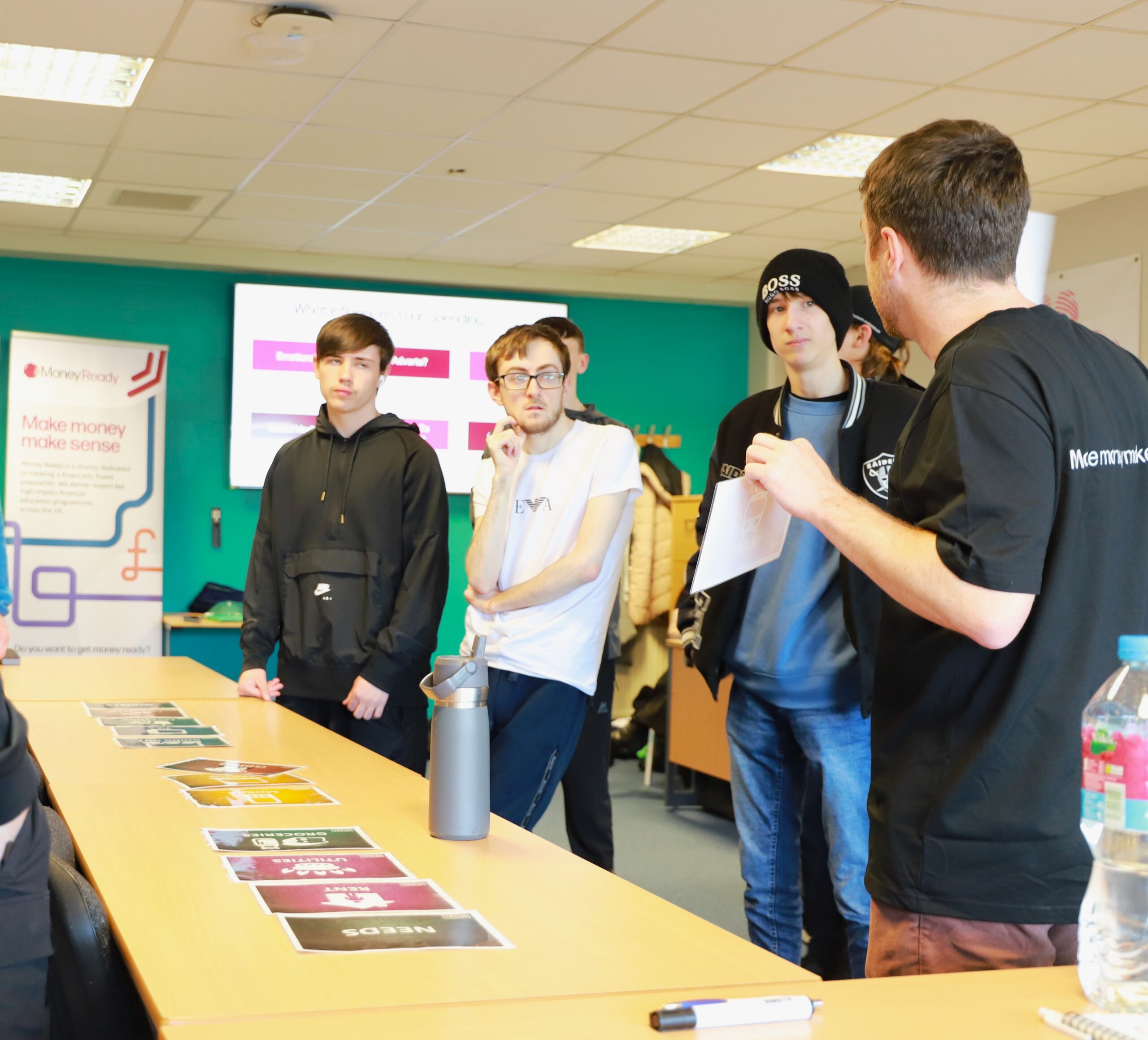 A group of youngsters being taught about money