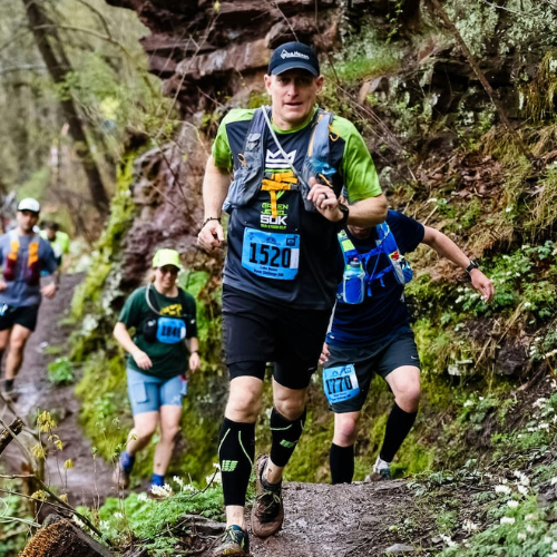 A group of Athletes running through the woods