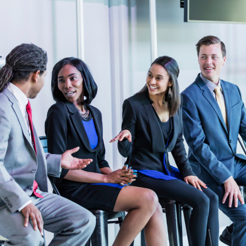 Panel of people smiling and talking to each other