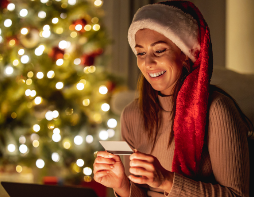 Women with laptop and card